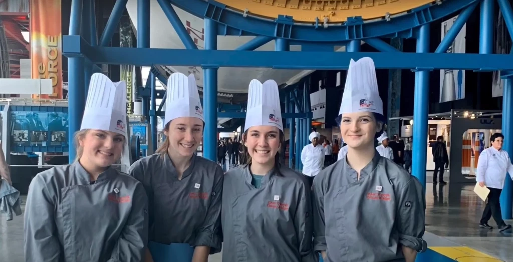 From left, Hewitt-Trussville High School HUNCH team members Lucy Prince, Kailey Love, Madeline Curd, and Abigail Mitchell at the HUNCH Culinary regional competition at the U.S. Space & Rocket Center in February. Credit: Lucy Prince
